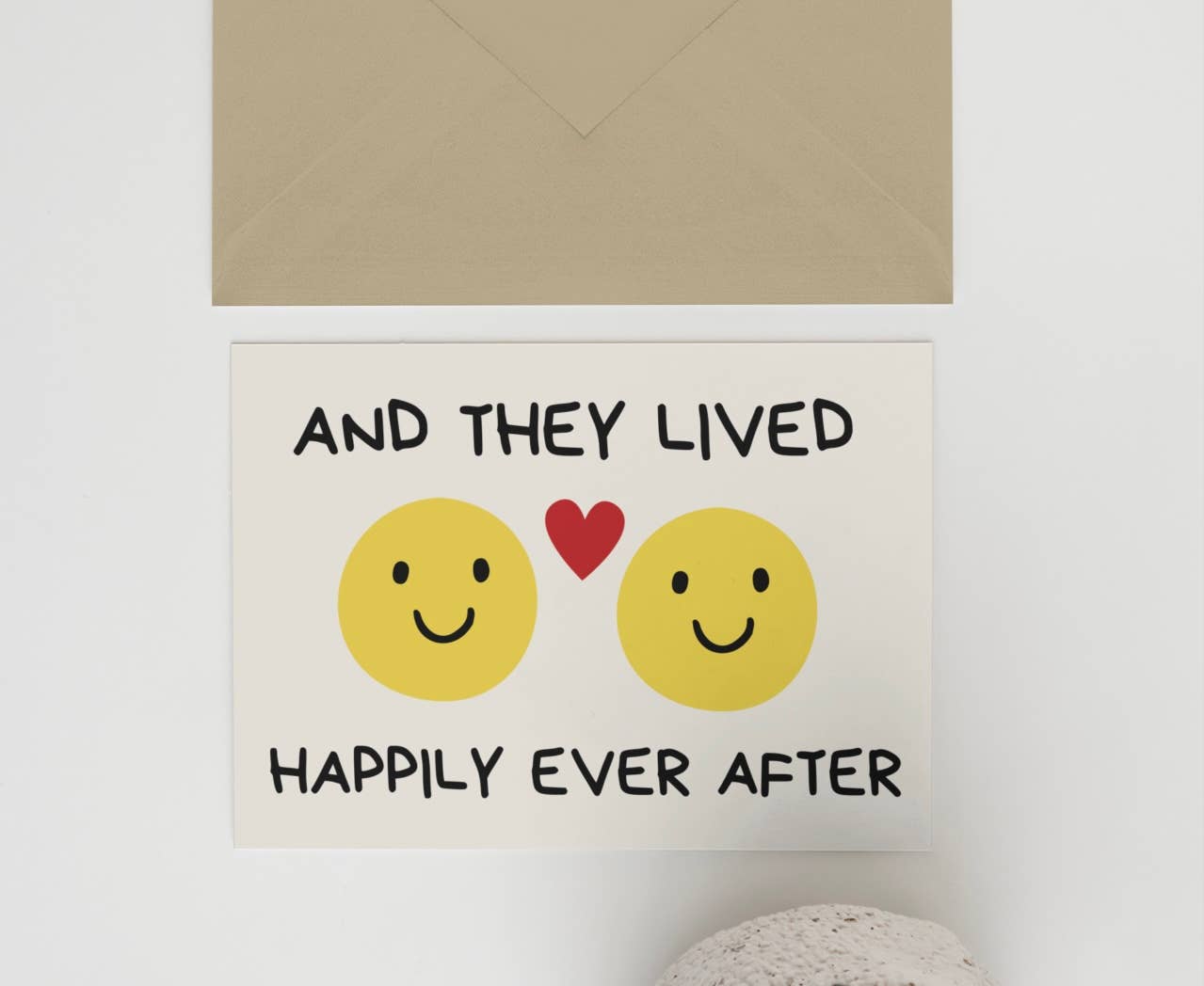 Decorative sign with smiley faces and text on a wall