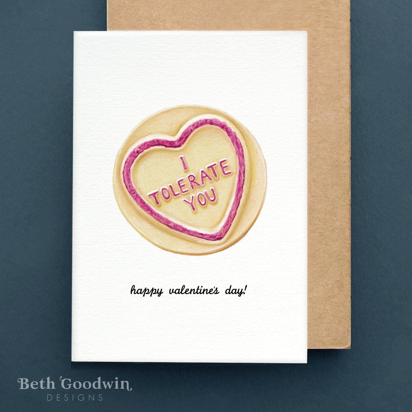 Valentine's Day card with a heart-shaped cookie and 'I Tolerate You' text on a white background.