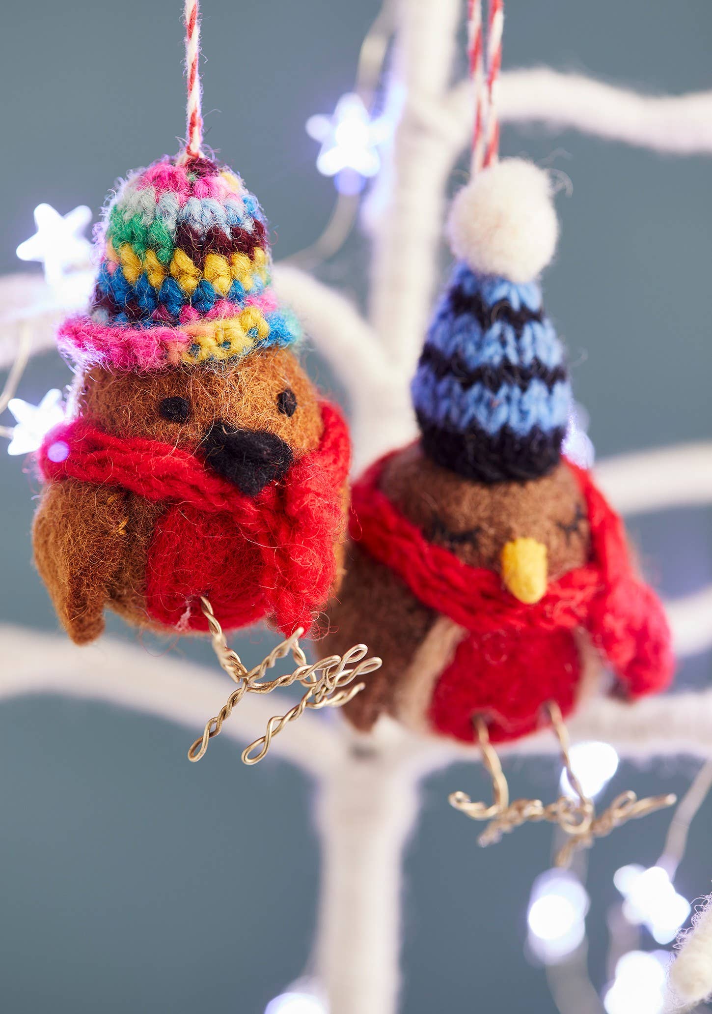 Felted robin with woolly hat and scarf.