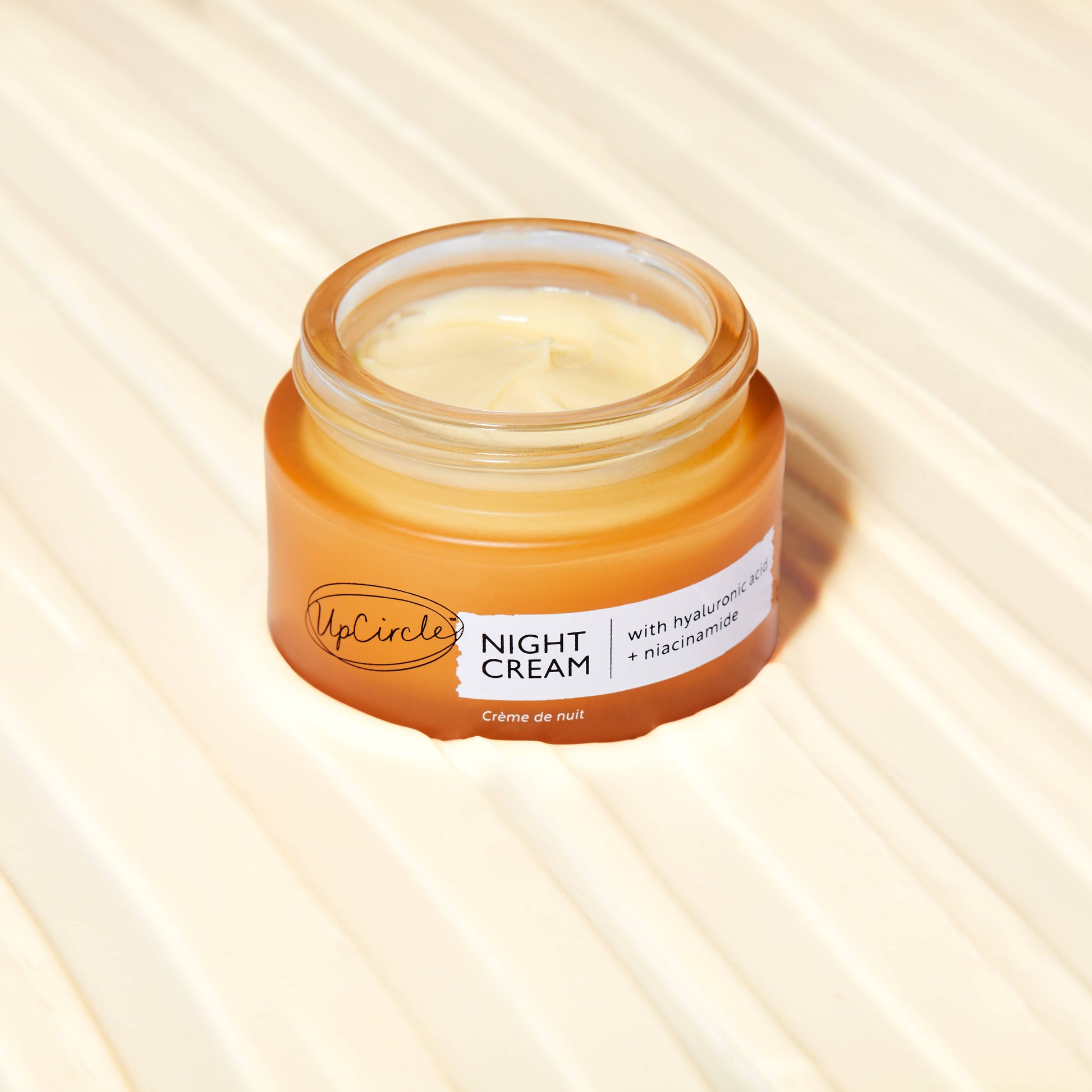 Natural Vegan night cream in glass jar.  containing hyaluronic acid and niacinamide