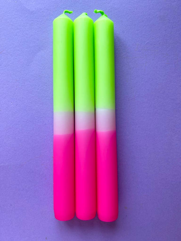 dip dyed candles. bright pink band, pale pink and topped with a lime green.