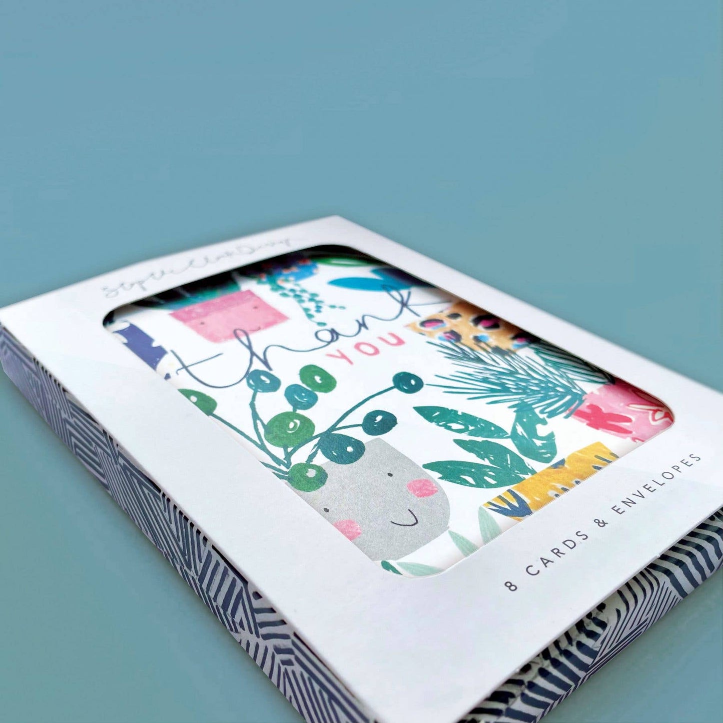 Packaged set of greeting cards with a blue background