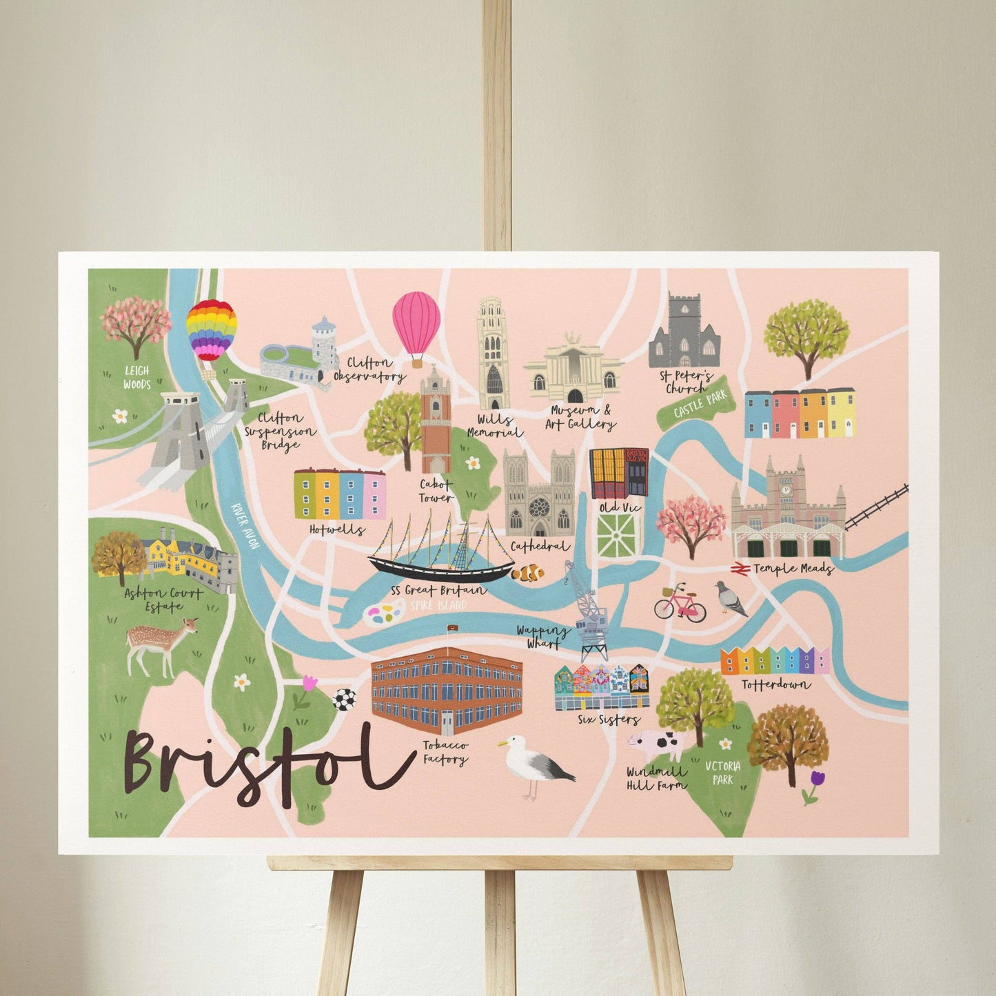 Illustrated map of Bristol on a stand against a plain wall