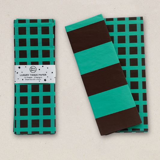 Luxury tissue paper with green and brown checkered and striped patterns on a beige background.