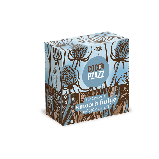 A square product box for Coco Pazzz traditional smooth fudge with spiced caramel, featuring a botanical pattern in light blue, brown, and white.