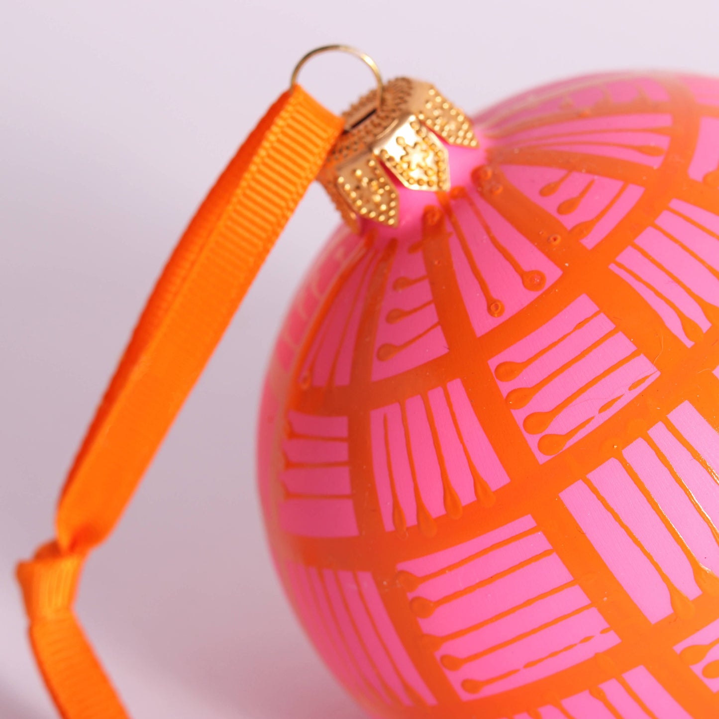 Lines Glass Christmas Bauble Orange on Pink, 8cm