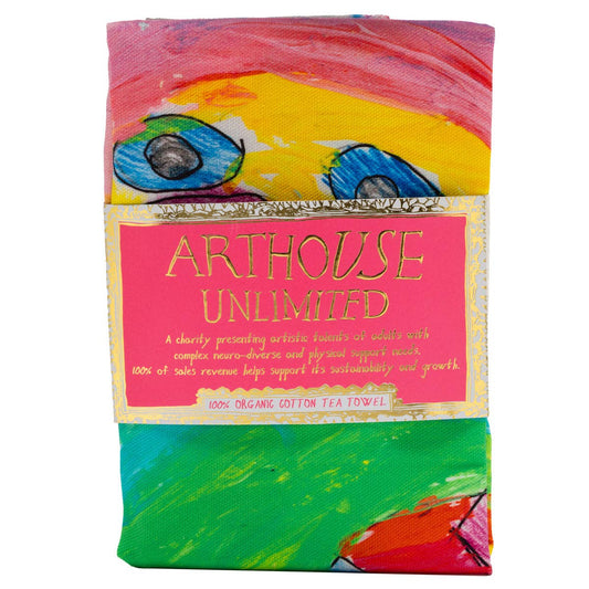 Colorful tea towel with 'Arthouse Unlimited' branding on a white background
