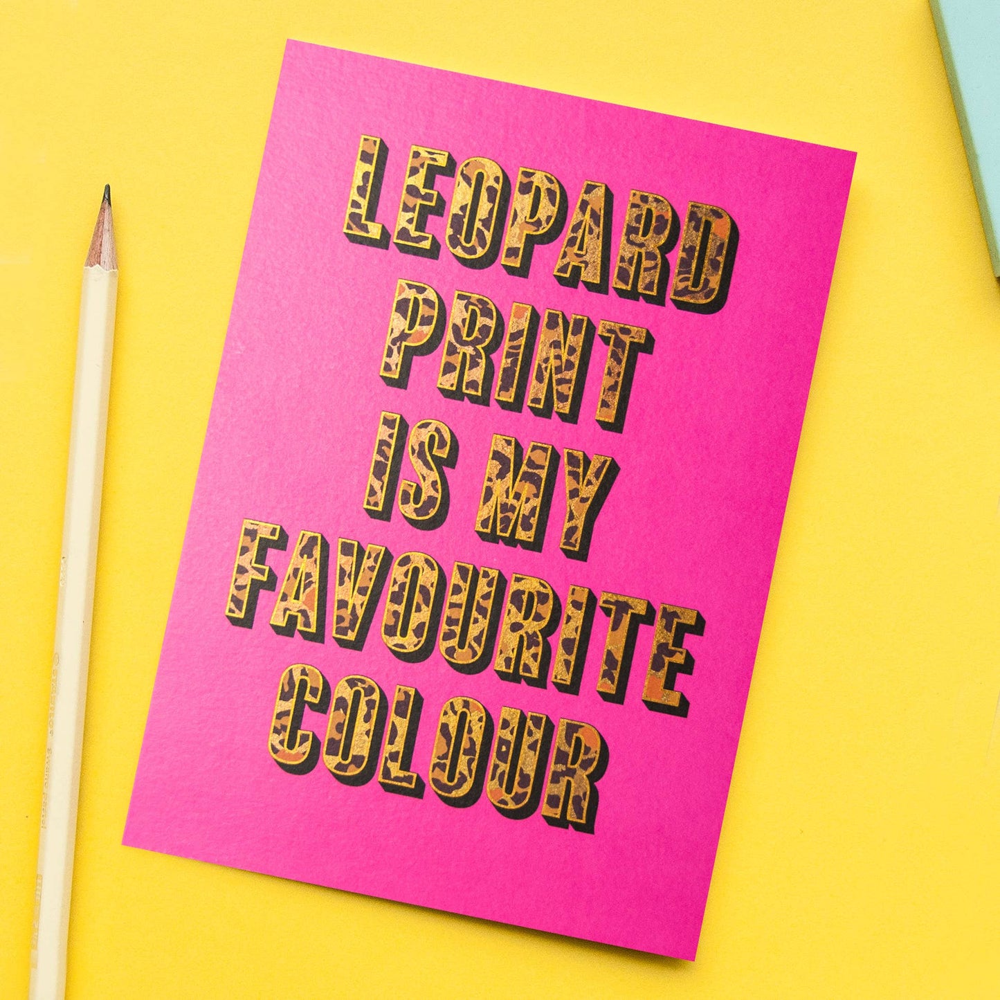 A hot pink card with the phrase "leopard print is my favourite colour" in leopard print block capitals.