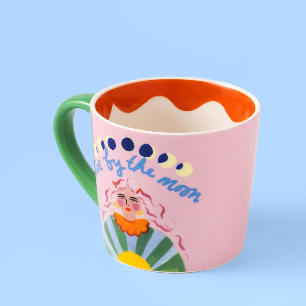 Colorful mug with a design and text on a light blue background
