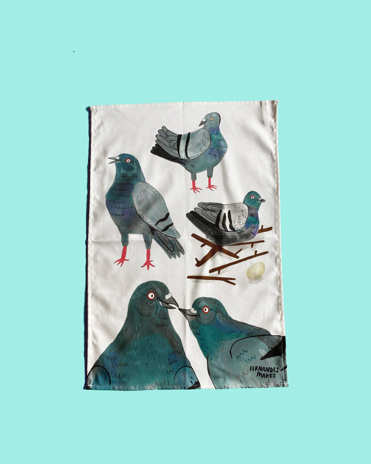 Tea towel with pigeon illustrations on a turquoise background