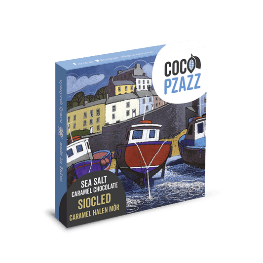 Coco Pzazz chocolate packaging with a coastal scene illustration