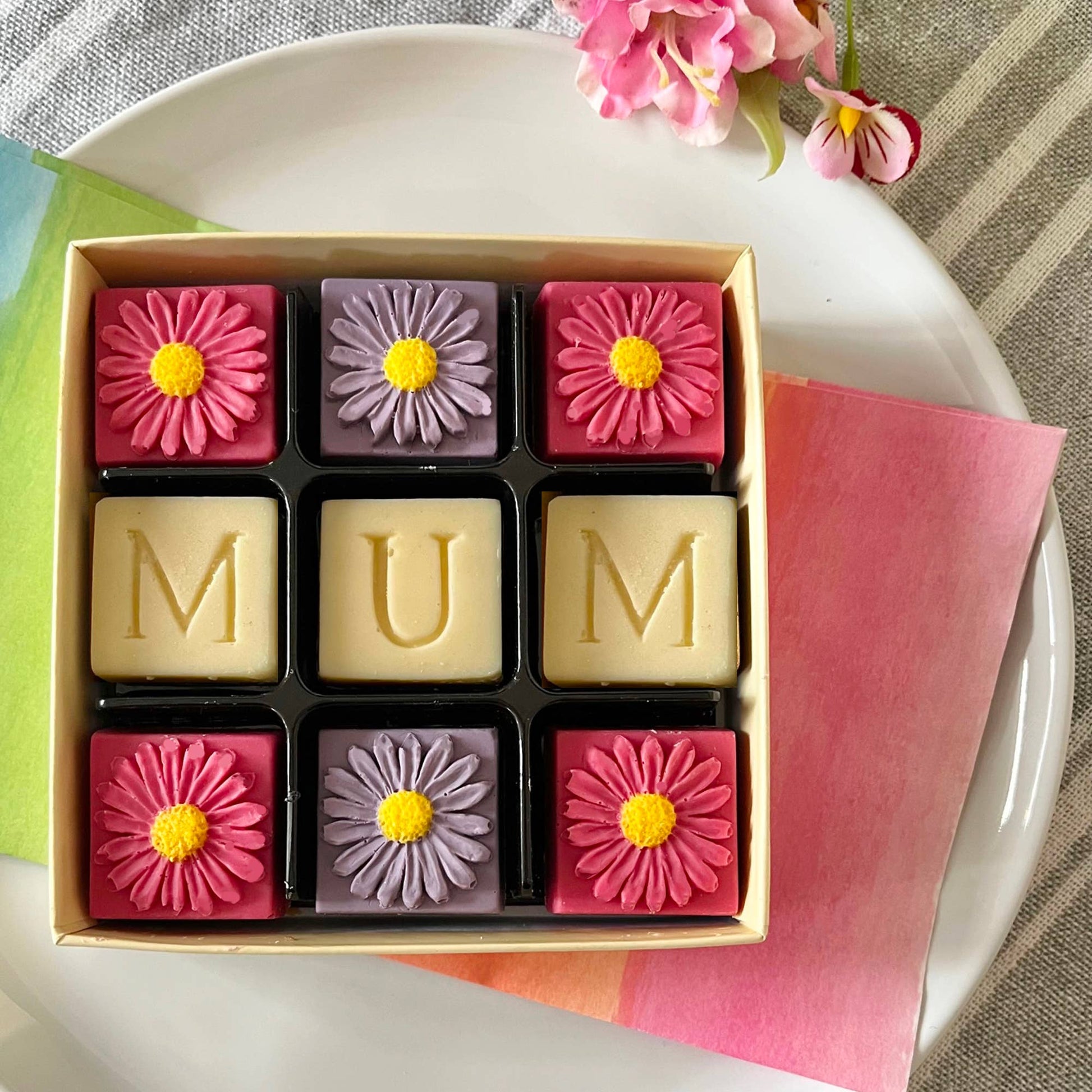 Belgium chocolate handmade in Somerset.  Mum in white chocolate and pink and lilac flowers.
