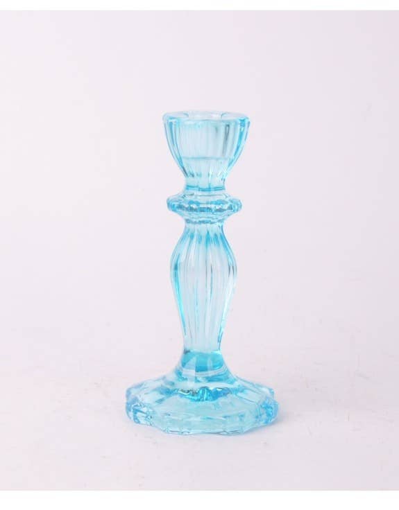 Blue glass candle holder on a white background