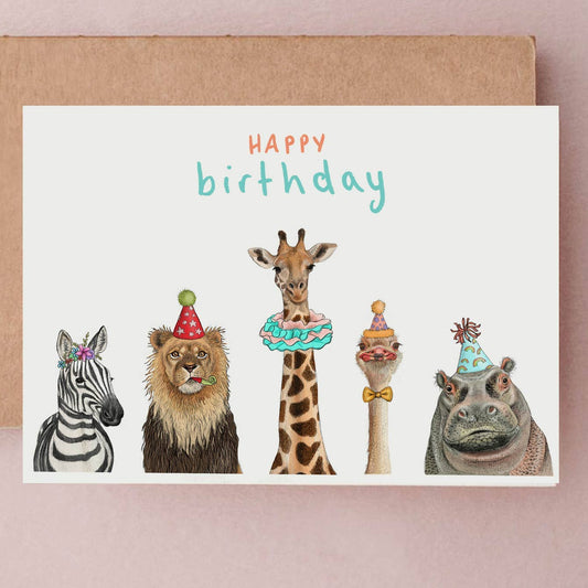 Birthday card with illustrated animals wearing party hats and cake decorations on a white background.