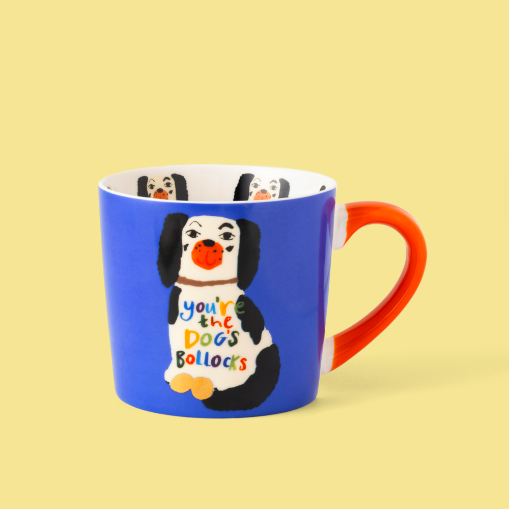 Blue mug with a cartoon dog design and text on a yellow background