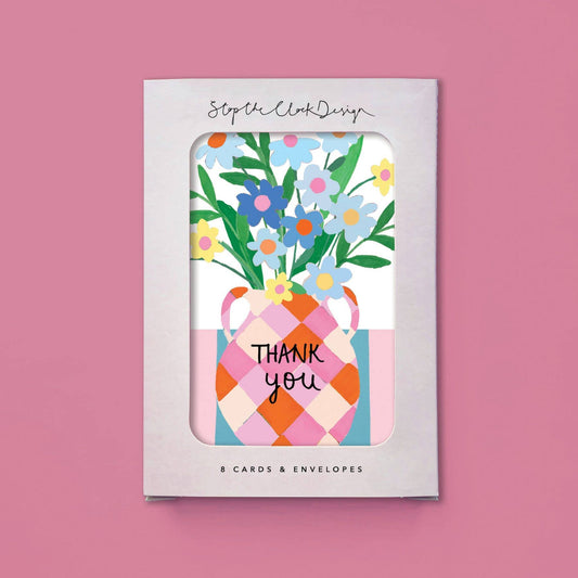 Pack of greeting cards with floral design and 'Thank you' text on a pink background