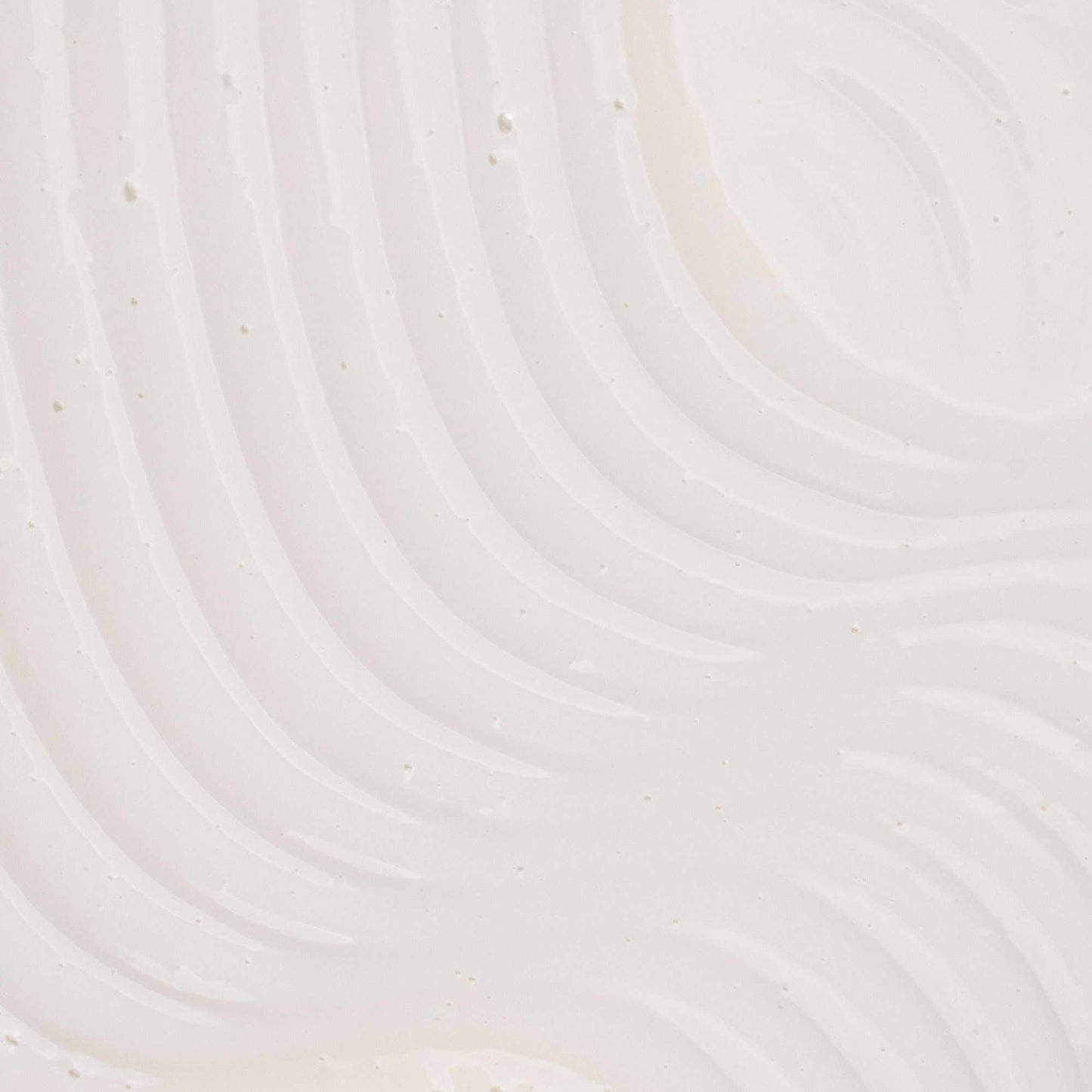 Close-up of a textured white surface with circular patterns