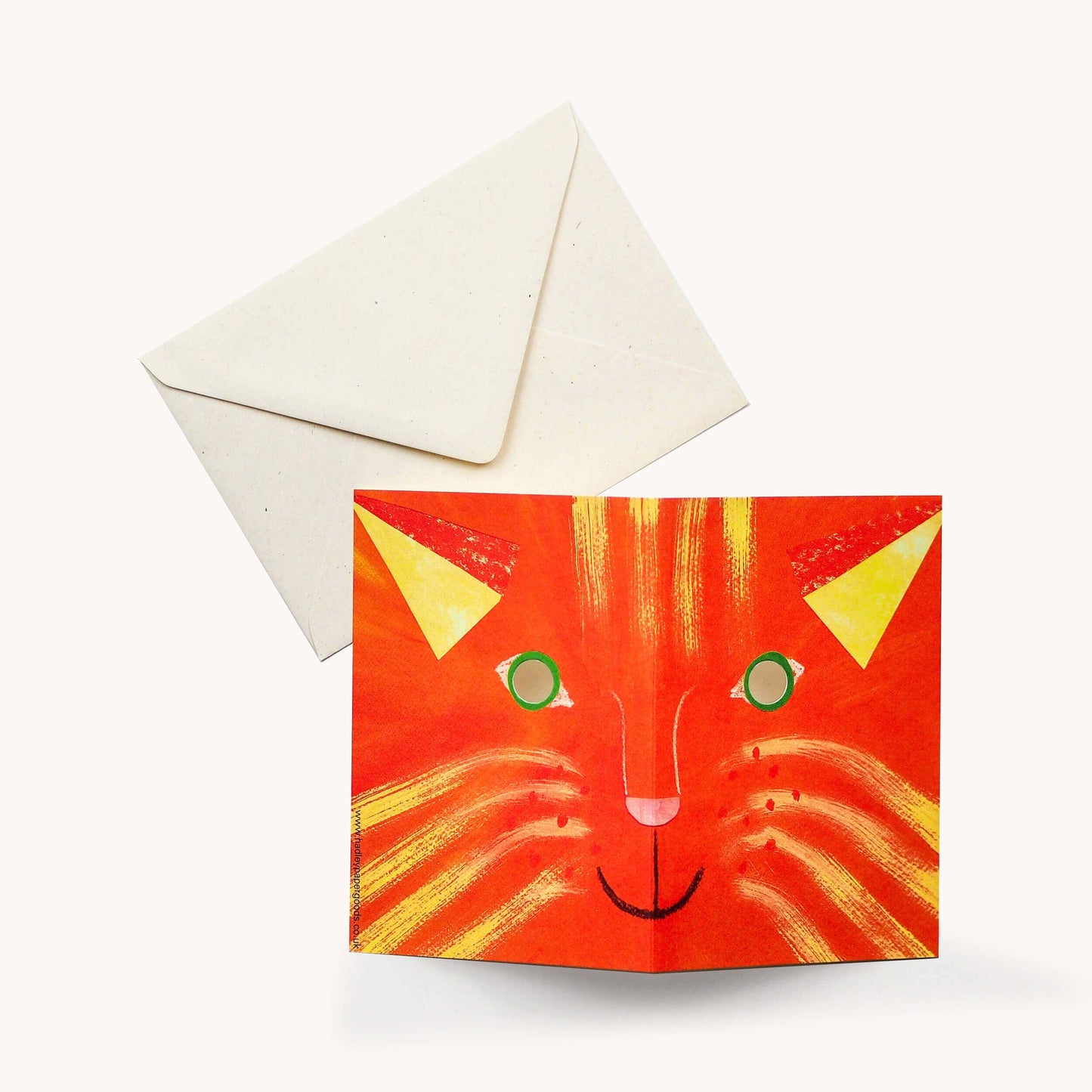 Greeting card with a cat design and envelope on a white background