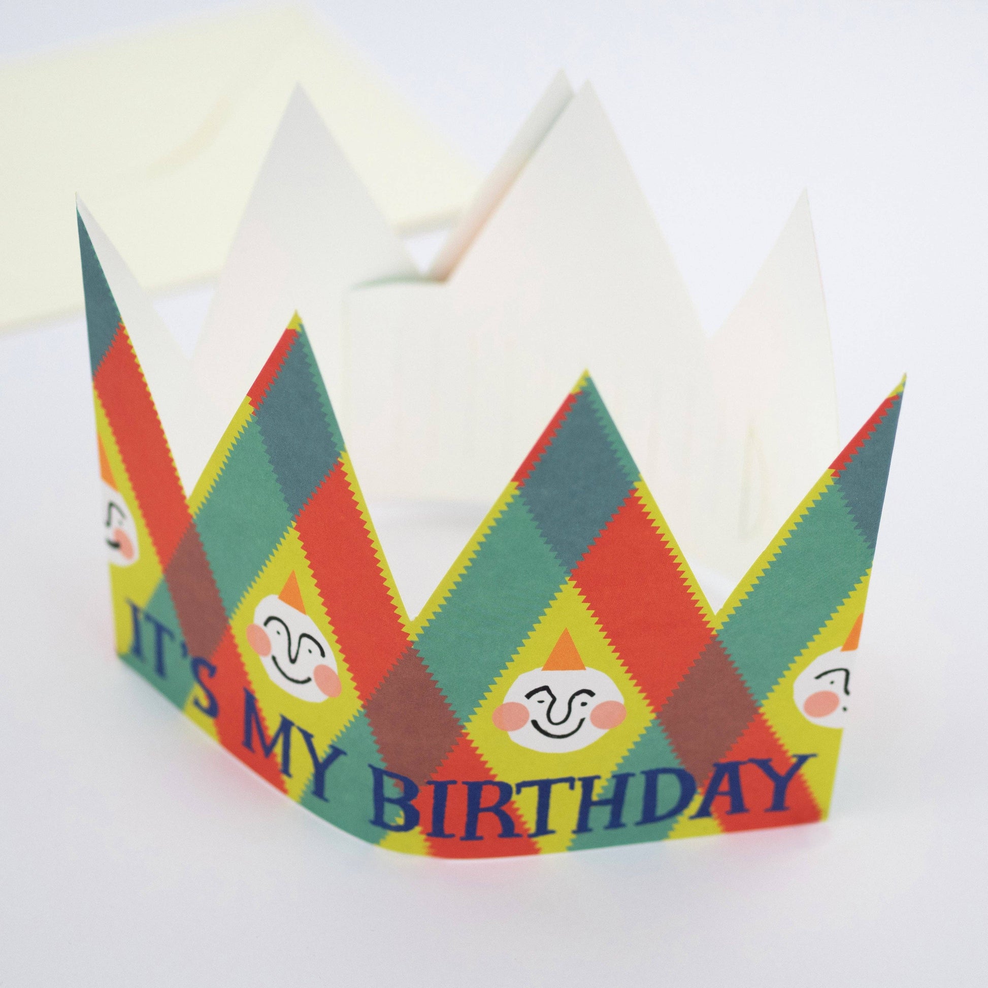 Colorful paper crown with 'It's My Birthday' text on a white background