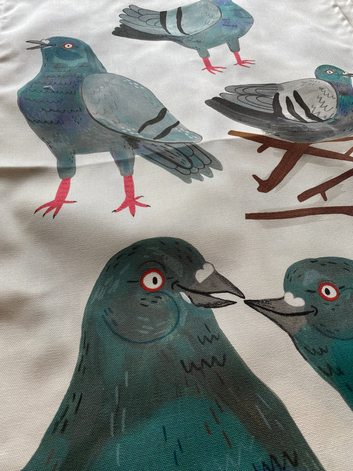 Illustration of pigeons on a fabric background