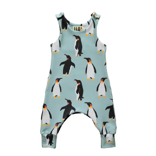 Grow with me baby romper, with adjustable poppers.  Fabric design with a pale blue background and penguins.