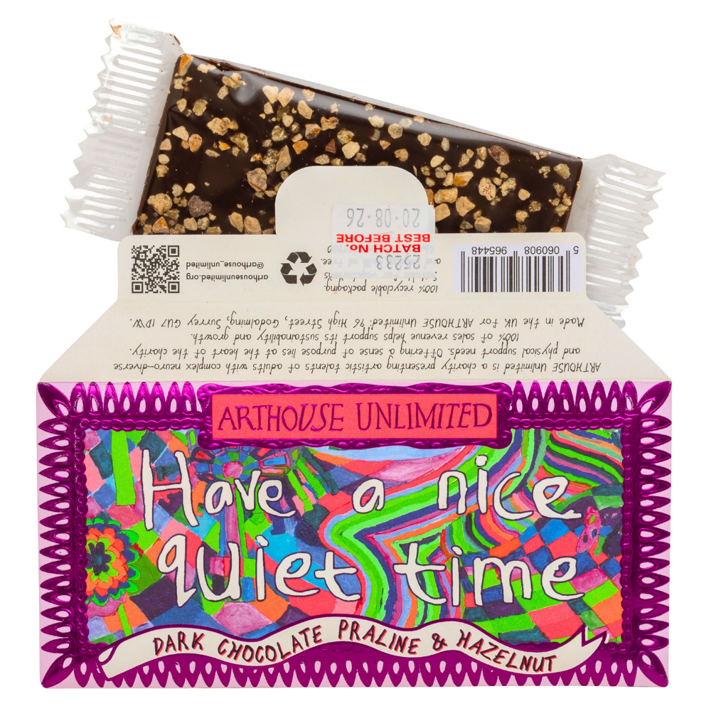 Dark chocolate praline and hazelnut package with colorful label and 'Arthouse Unlimited' branding.