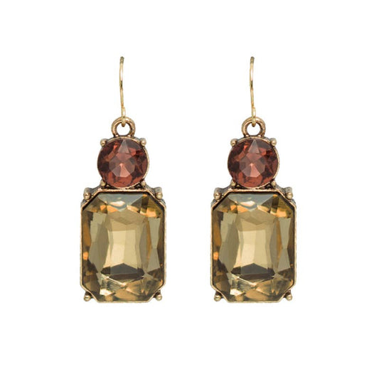 Pair of earrings with brown and yellow gemstones on a white background