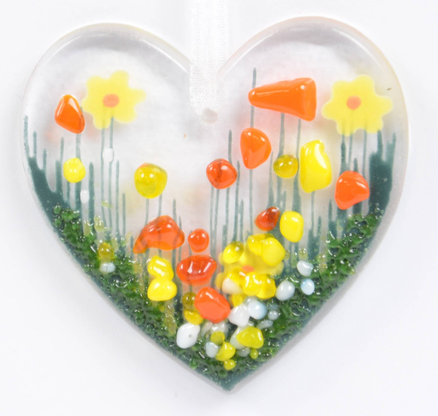 Heart-shaped object with a floral design on a white background