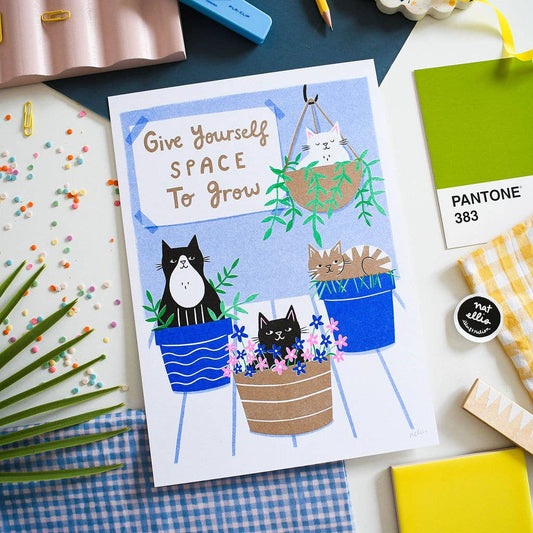 Card with cats in plant pots and motivational text on a colorful background