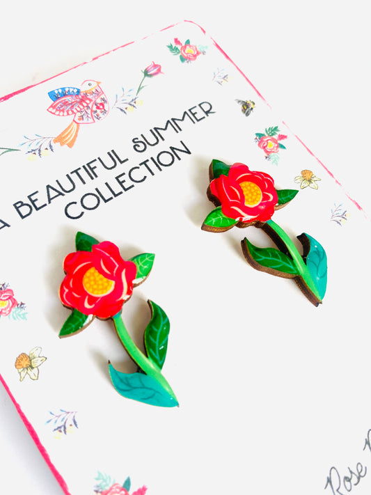 Resin and wooden flower earrings with stem.