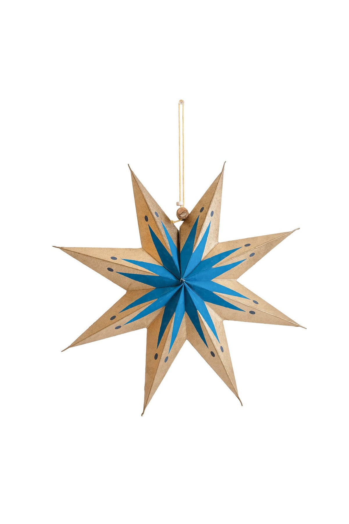 A wooden eight-pointed star hanging ornament with a blue painted starburst center and small black dot details, suspended by a thin gold string against a plain white background.