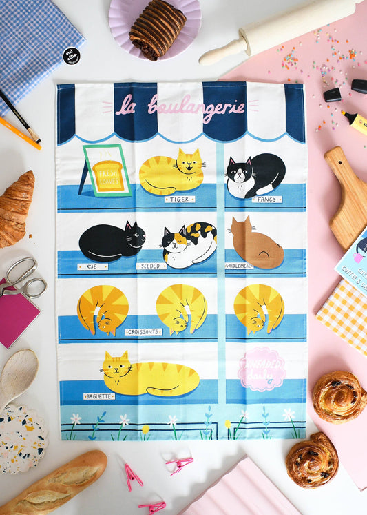 Foil paper with cat illustrations on a table with baking items