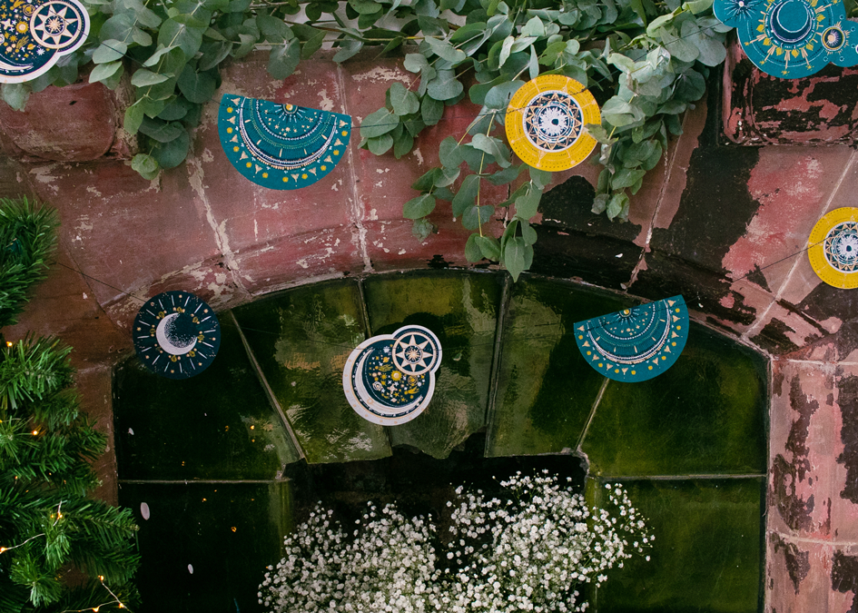 Decorative wall with circular patterns and greenery