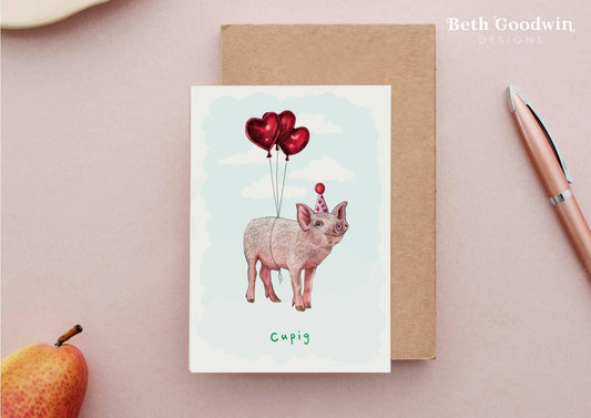 Card with a pig illustration and heart balloons on a pink background, featuring the brand 'Beth Goodwin'.