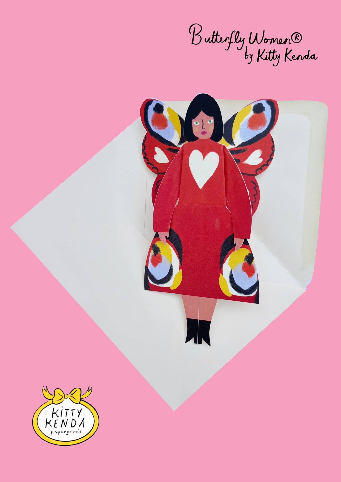 Butterfly-themed paper doll with colorful wings and a red dress on a pink background, featuring 'Kitty Kenda' branding.