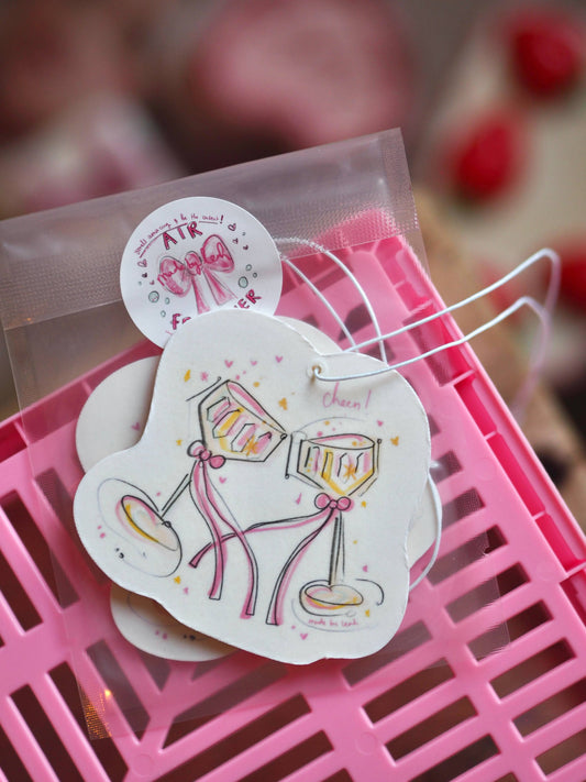 Decorative stickers with pink designs on a pink surface