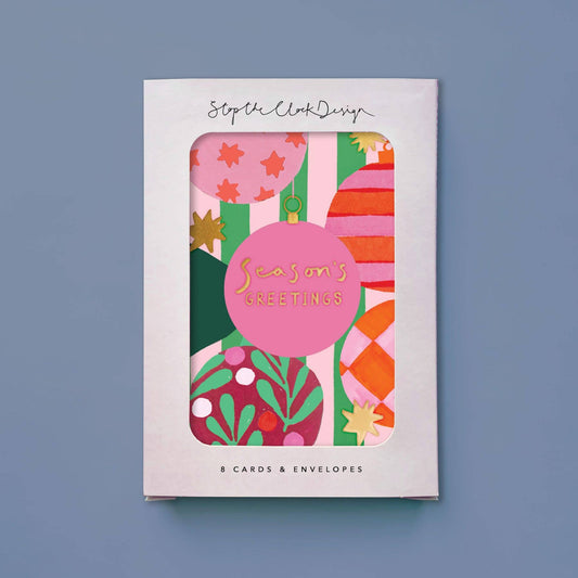 Pack of Christmas cards with colorful design on a blue background