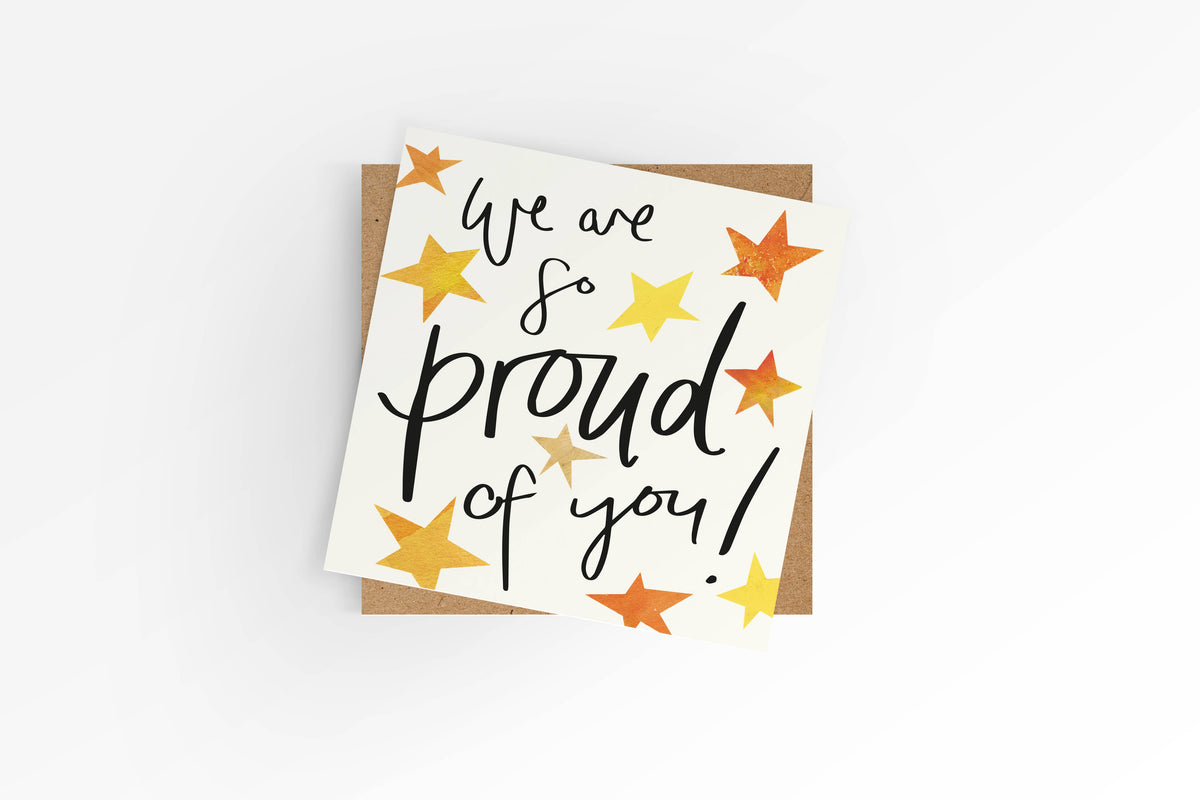 Card with 'We are so proud of you!' text and star illustrations on a white background