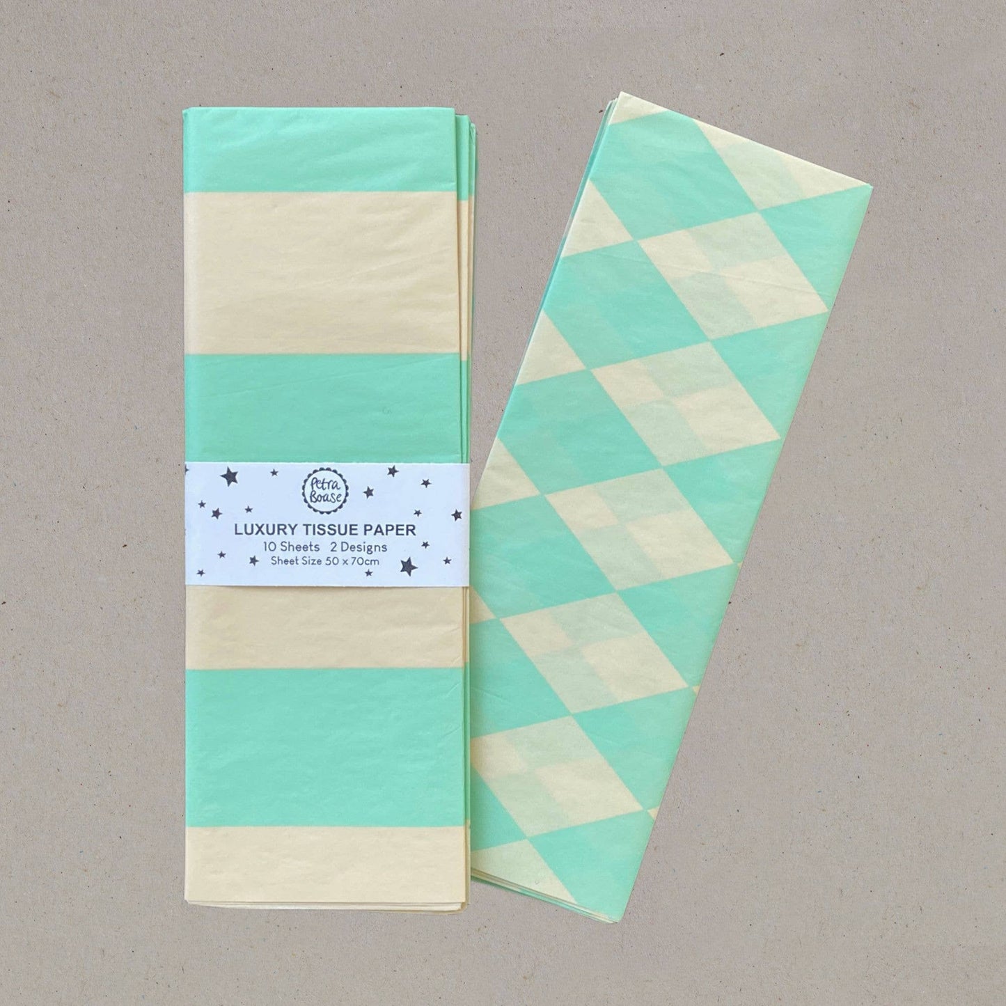 Packaged luxury tissue paper with geometric design on a gray background