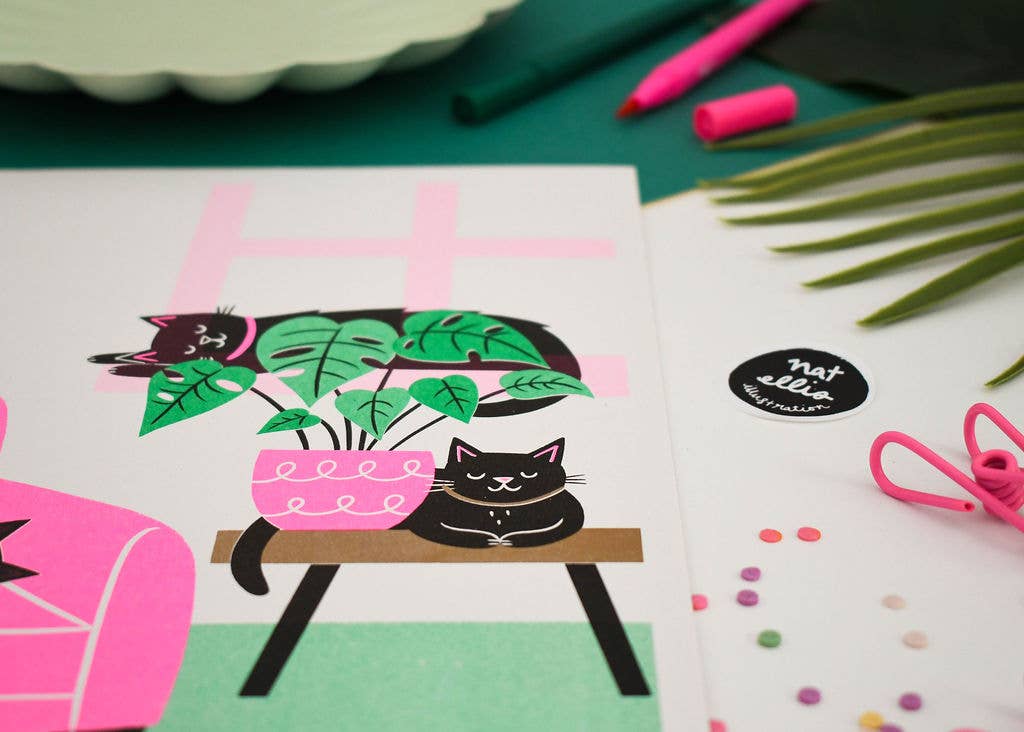 Illustration of a black cat with plants on a table, surrounded by stationery items.