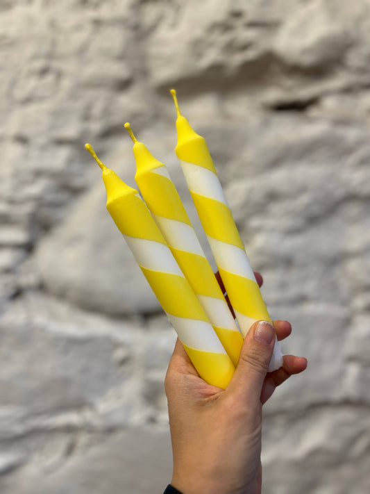 Helter skelter yellow and white spiral dinner candles.