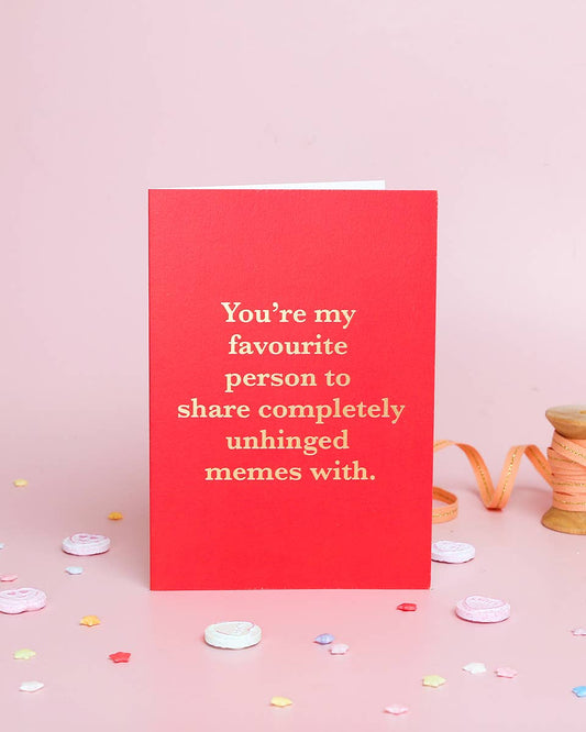 Red card with white text on a pink background