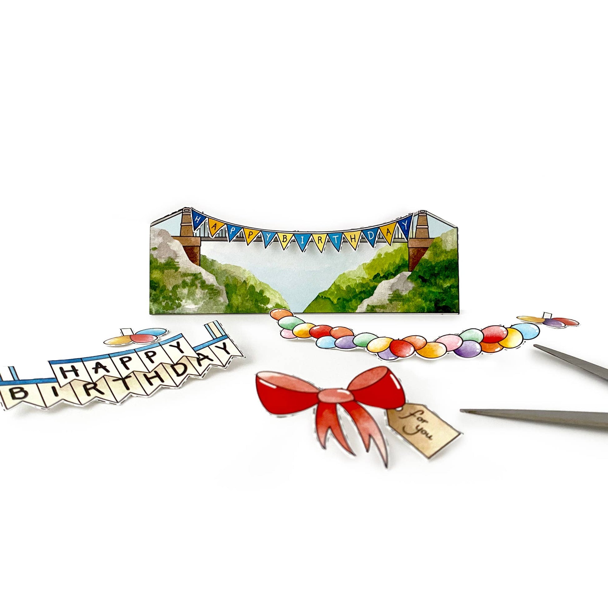 Decorative birthday banner with scenic background, colorful beads, and a red bow on a white background.