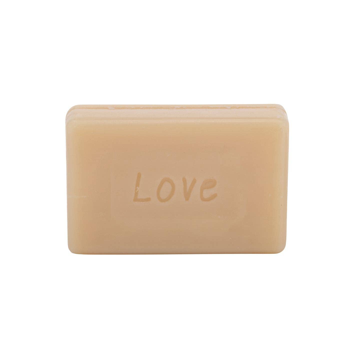 Bar of soap with 'LOVE' embossed on a white background