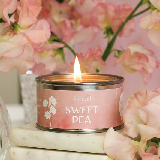 Sweetpea hand poured candle in a small tin with lid.