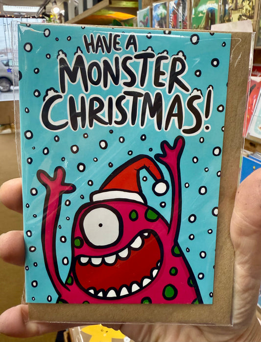 A googly eyed monster.  Text reads Have a Monster Christmas