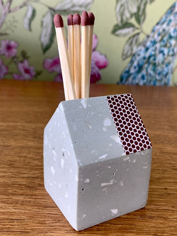 Matchstick holder in the shape of a little house made from jesomite