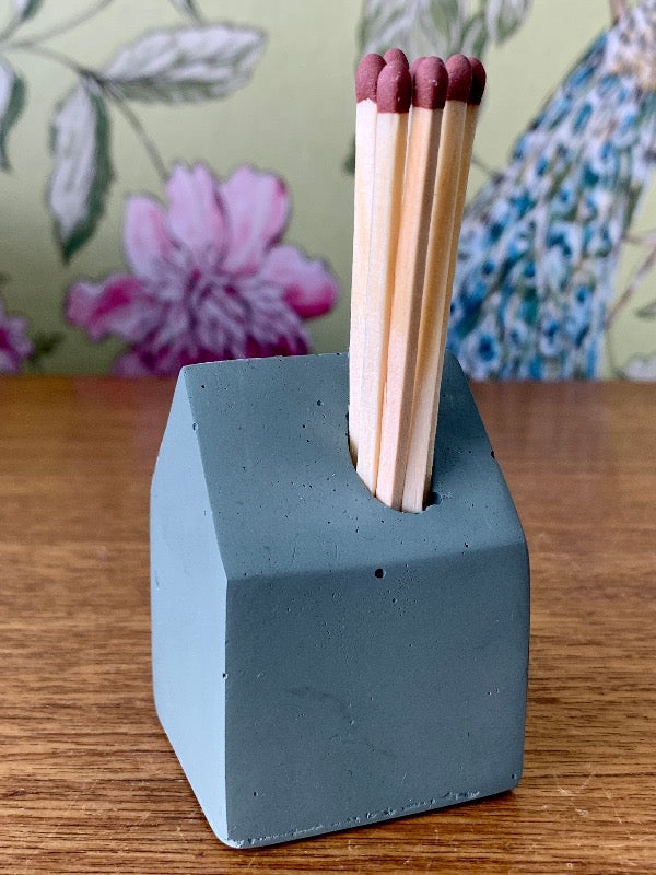 Matchstick holder in the shape of a little house made from jesomite