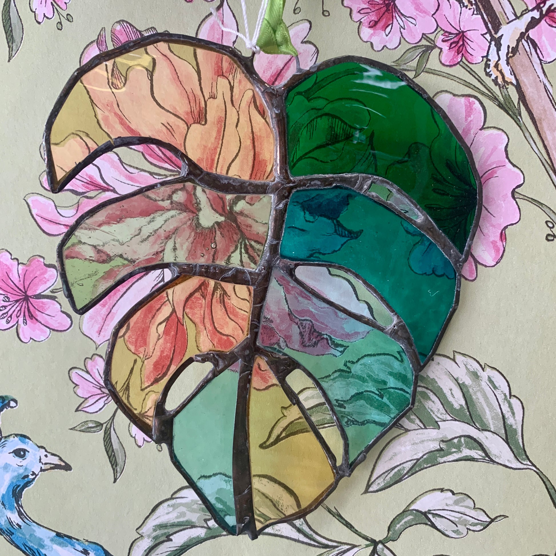 Stained Glass sun catcher. Monstera Leaf. Dadswell Glass studio based in Bristol.