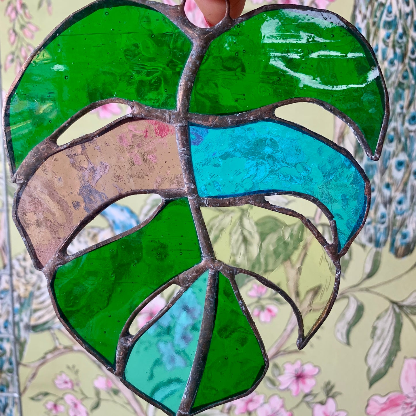 Stained Glass sun catcher. Monstera Leaf. Dadswell Glass studio based in Bristol.